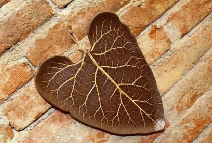 Photo of Ceramic hanging decoration in brown color