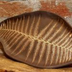 Photo of Large ceramic tray in shape of leaf in brown color